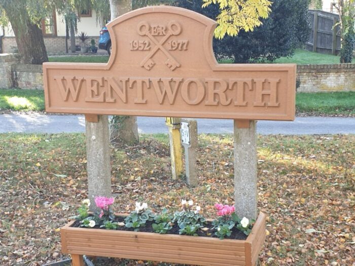 Wentworth road sign and flowers