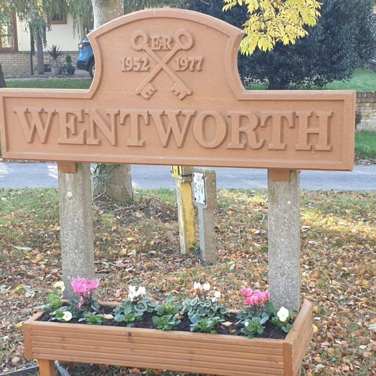 Wentworth road sign and flowers