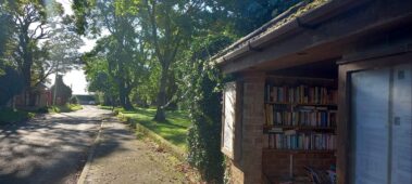Village bus stop with books on shelves