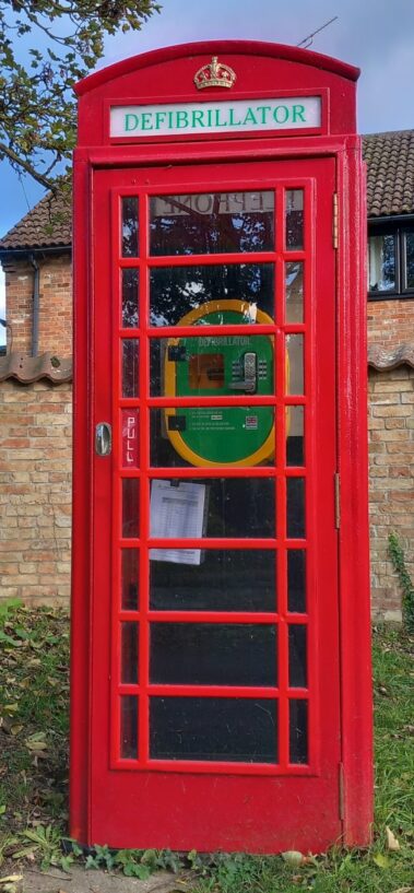 Red telephone box with a aed defib inside