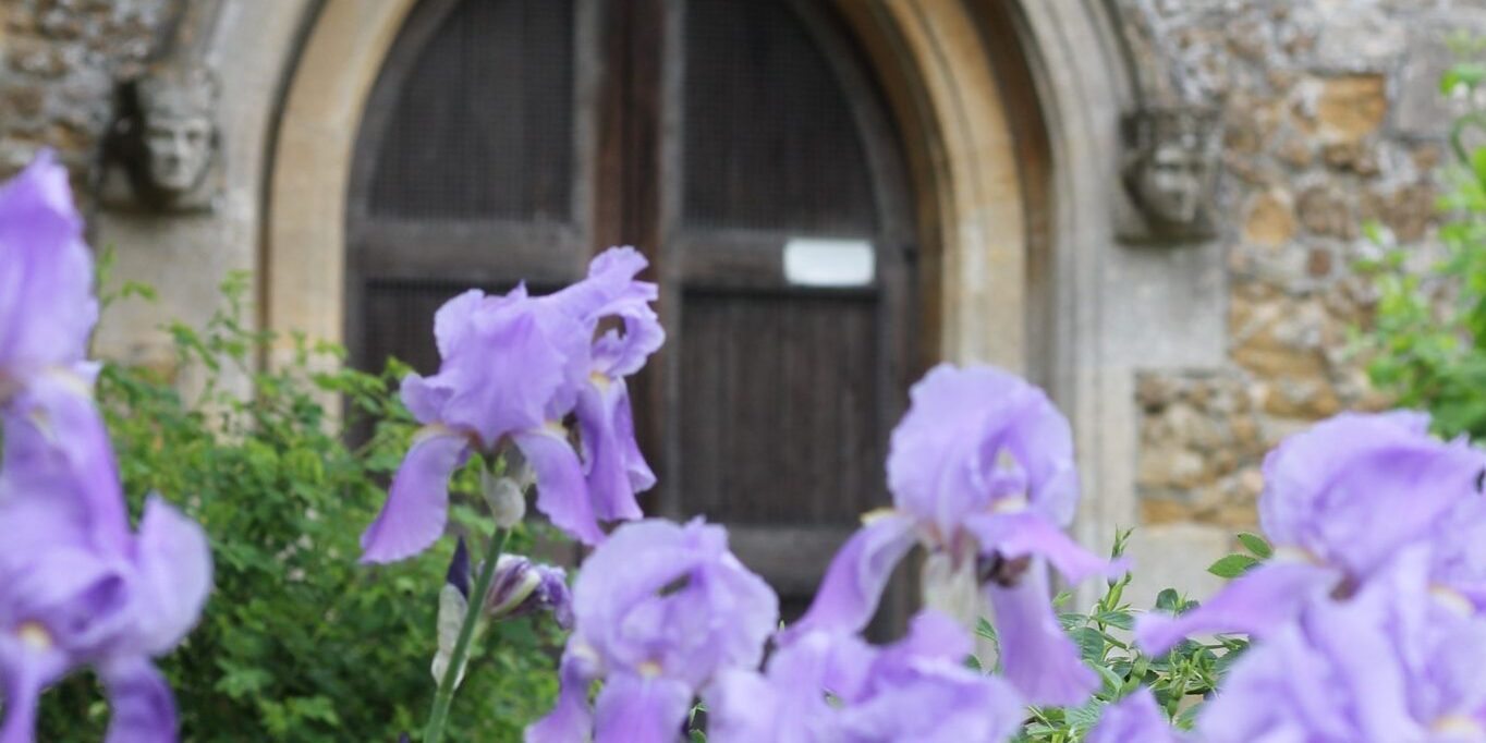 church 1 Church door in the summer with wild snap dragons blooming